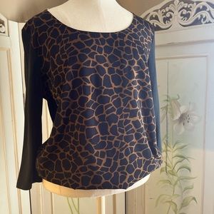 Ann Taylor 3/4 sleeve Giraffe print with black sleeves and button up back.Size M